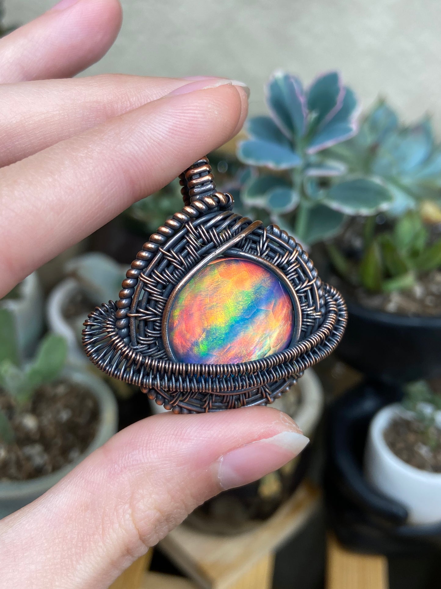 Aurora Opal Saturn amulet