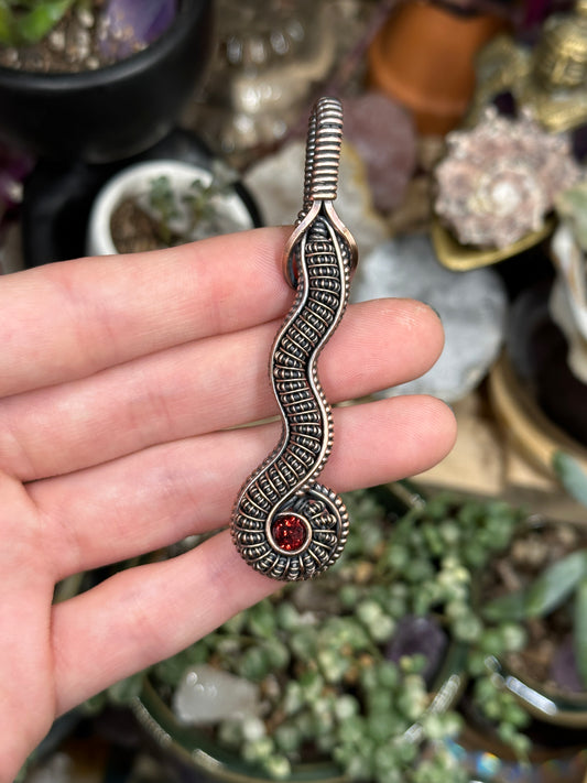 Garnet snake amulet